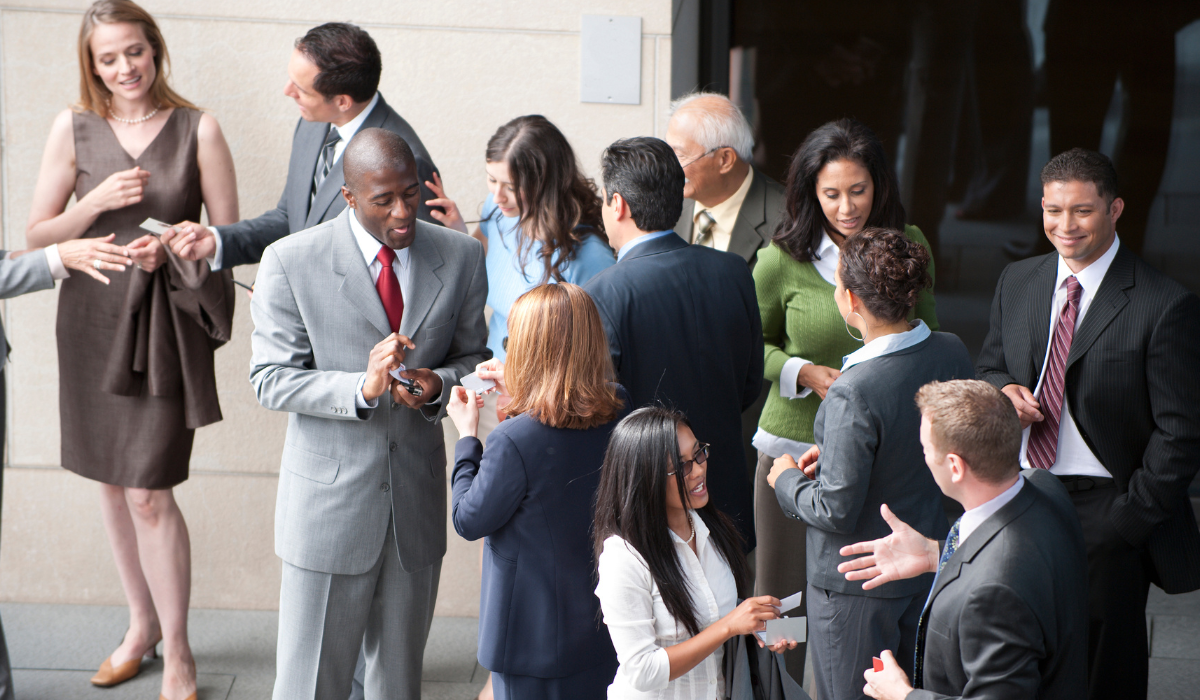 People networking and exchanging business cards