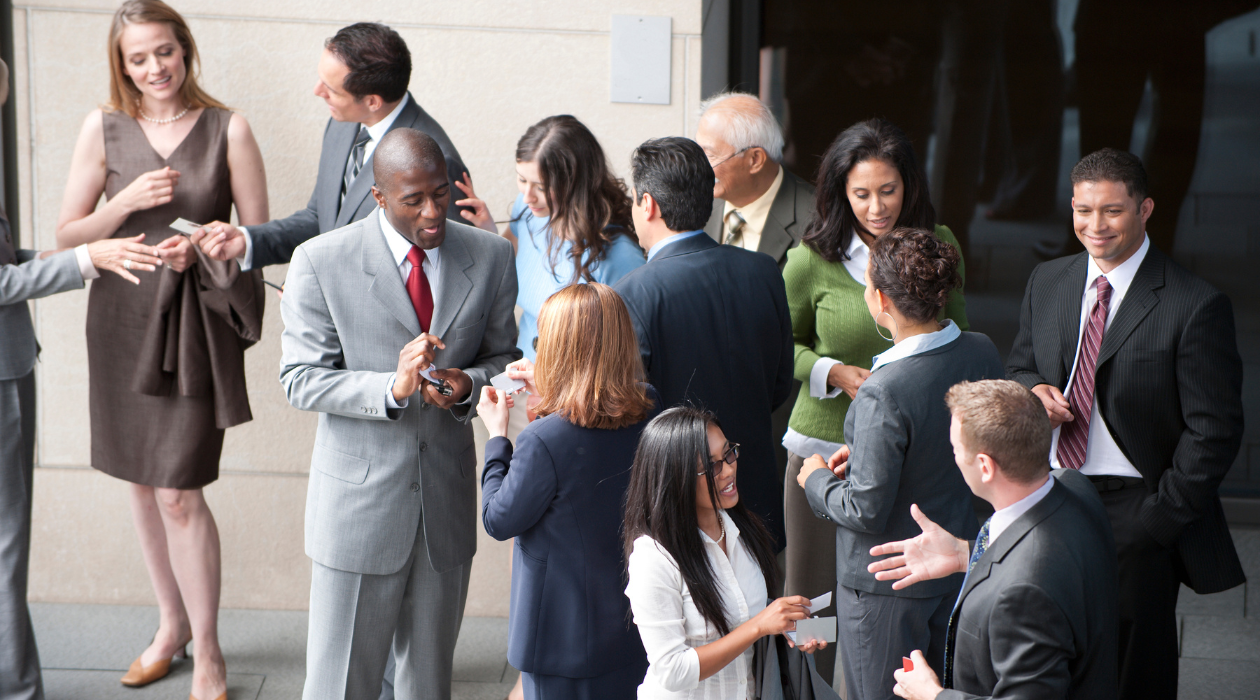 People networking and exchanging business cards